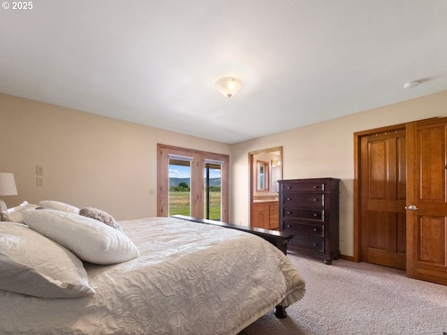62123 Chandler Loop, La Grande, OR 97850 - bedroom featuring access to outside, light carpet, and ensuite bath
