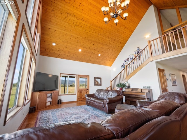 62123 Chandler Loop, La Grande, OR 97850 - living area with high vaulted ceiling, stairway, plenty of natural light, wooden ceiling, and a chandelier