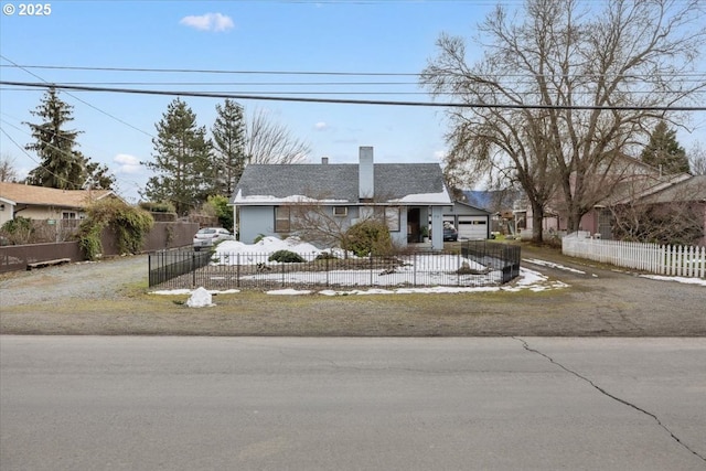 1711 Prune St, Medford, OR 97501 - view of front of property with an attached garage, a fenced front yard, and a chimney