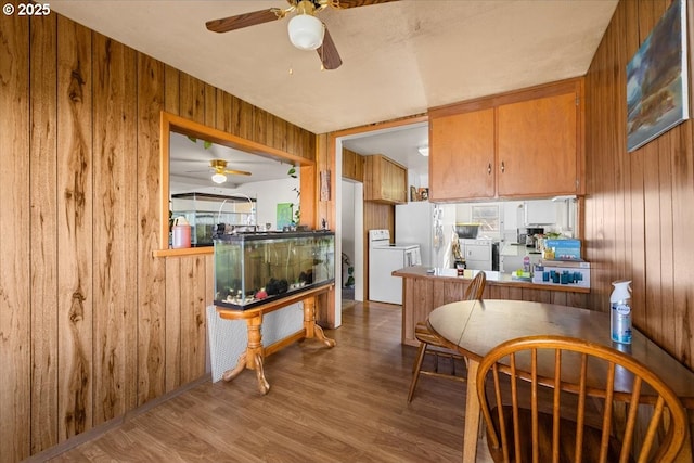 1711 Prune St, Medford, OR 97501 - kitchen with wooden walls, wood finished floors, and a ceiling fan