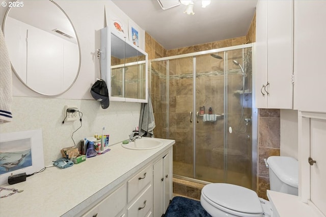 1711 Prune St, Medford, OR 97501 - full bathroom with tile walls, toilet, vanity, and a shower stall