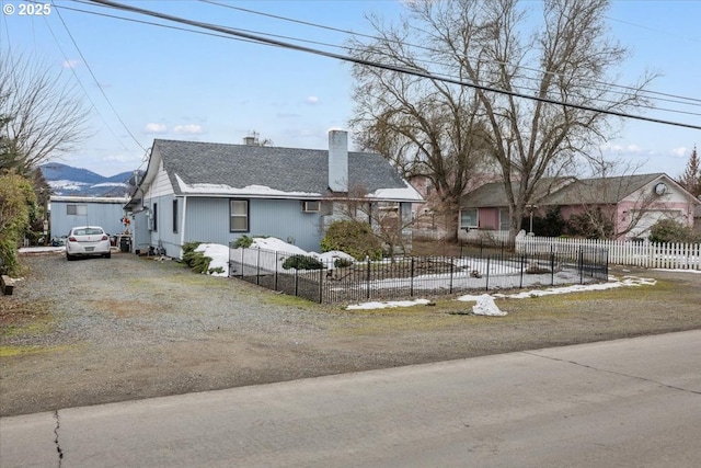 1711 Prune St, Medford, OR 97501 - view of front of property featuring driveway, a chimney, and a fenced front yard