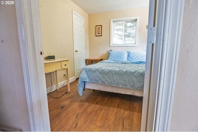 bedroom featuring wood finished floors