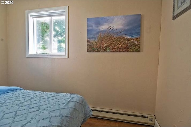 bedroom featuring a baseboard heating unit