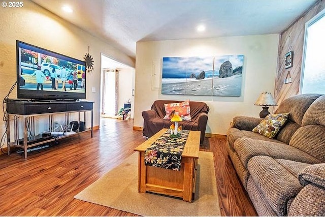living room with recessed lighting and wood finished floors