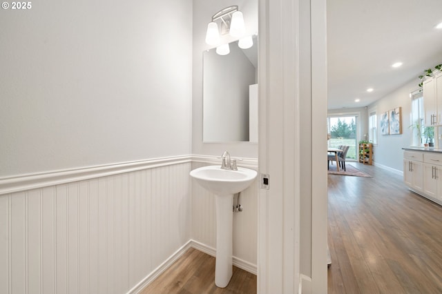 bathroom featuring recessed lighting, baseboards, and wood finished floors