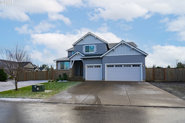 view of front of home with fence, a front lawn, a garage, board and batten siding, and concrete driveway