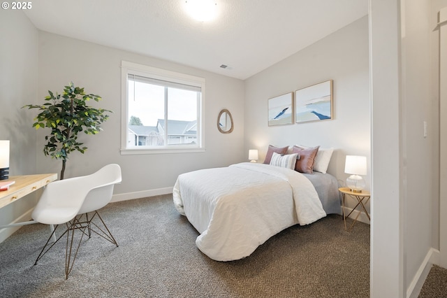 bedroom featuring baseboards, visible vents, and carpet