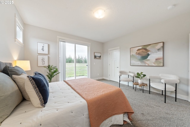 carpeted bedroom featuring baseboards, access to outside, and multiple windows