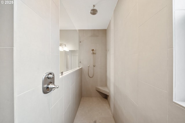 bathroom featuring tiled shower