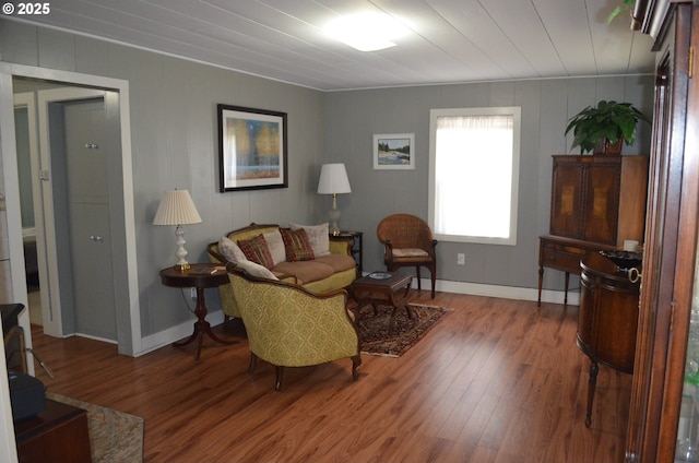 living area featuring wood finished floors and baseboards