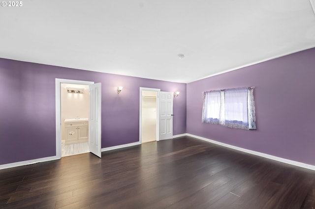 404 Chinook Ave, Astoria, OR 97103 - empty room with wood finished floors and baseboards