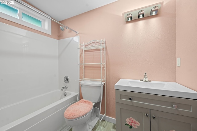 404 Chinook Ave, Astoria, OR 97103 - bathroom with toilet, shower / bath combination, vanity, baseboards, and a textured wall