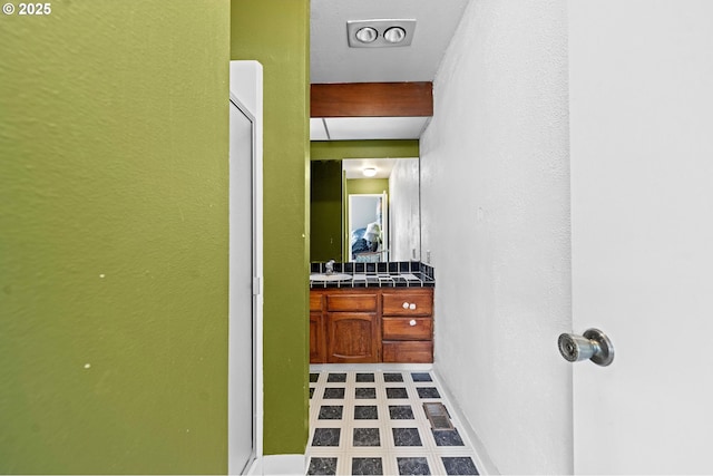404 Chinook Ave, Astoria, OR 97103 - bathroom featuring vanity, tile patterned floors, and baseboards