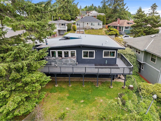404 Chinook Ave, Astoria, OR 97103 - rear view of property featuring a residential view, a wooden deck, and a lawn
