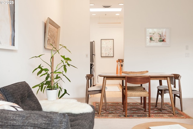 dining room featuring recessed lighting