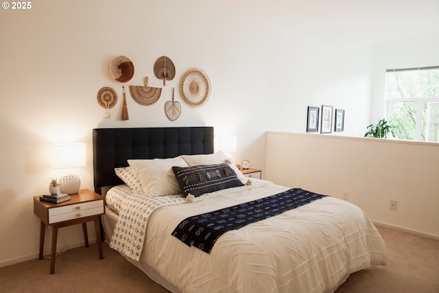 bedroom featuring baseboards and carpet floors