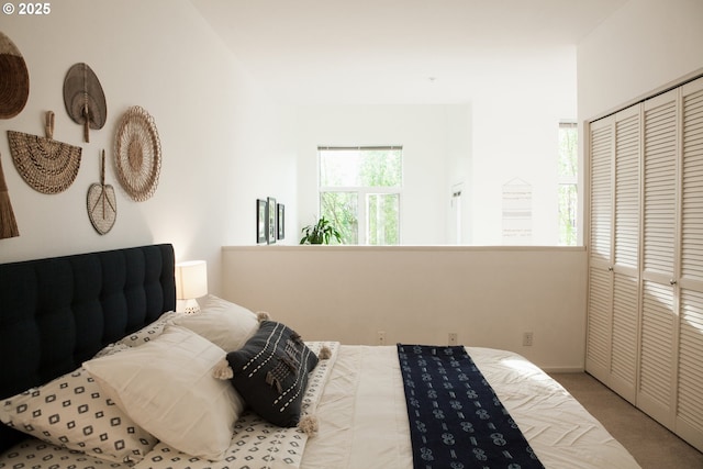 bedroom with a closet and carpet floors