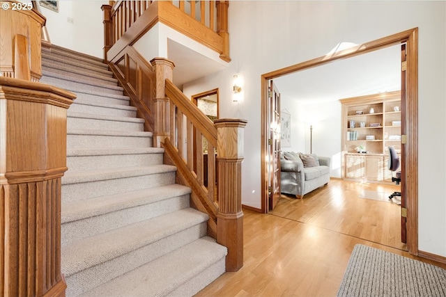 staircase with wood-type flooring