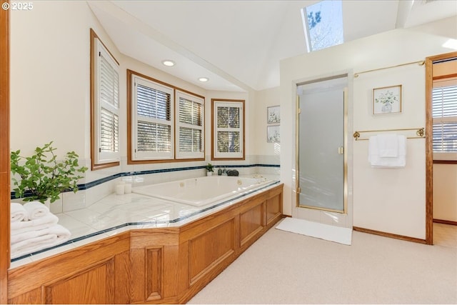 bathroom featuring separate shower and tub