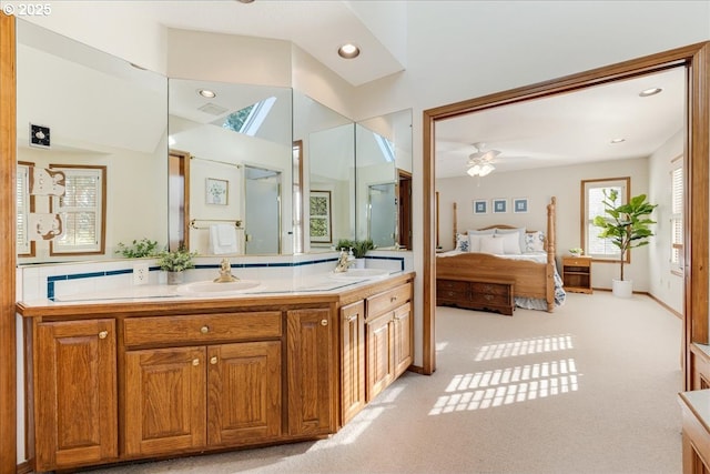 bathroom with vanity, lofted ceiling, and ceiling fan