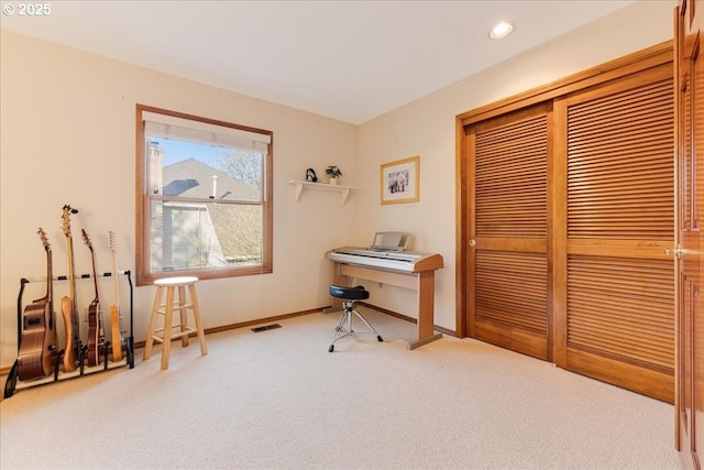 miscellaneous room with light colored carpet