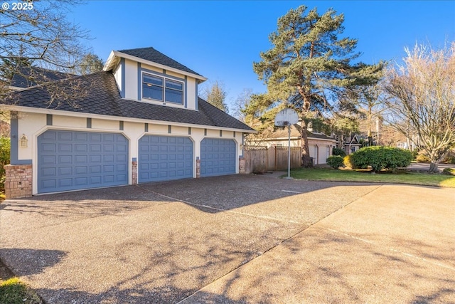 view of side of home featuring a garage