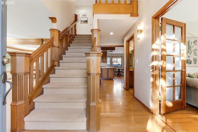 staircase featuring hardwood / wood-style flooring