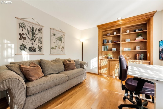 office area with light hardwood / wood-style flooring