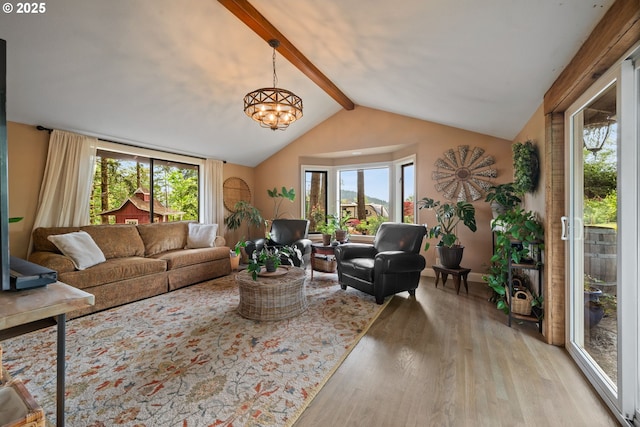 living area featuring light wood-style flooring and a chandelier