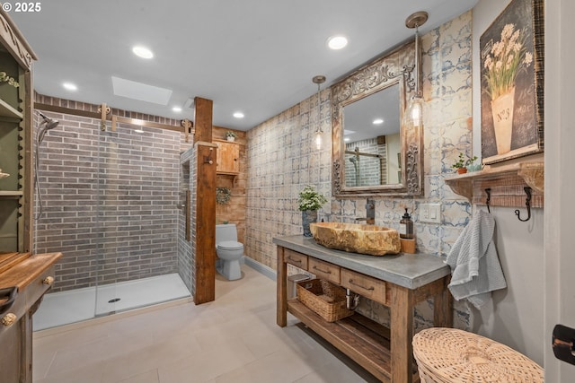 full bath featuring a shower stall, toilet, vanity, tile patterned floors, and recessed lighting