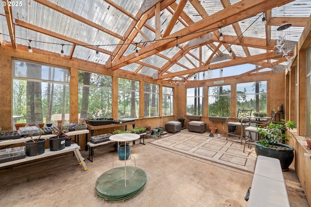 sunroom with high vaulted ceiling