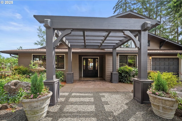 view of exterior entry with a pergola