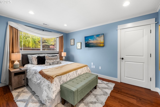 bedroom with ornamental molding, baseboards, recessed lighting, and wood finished floors