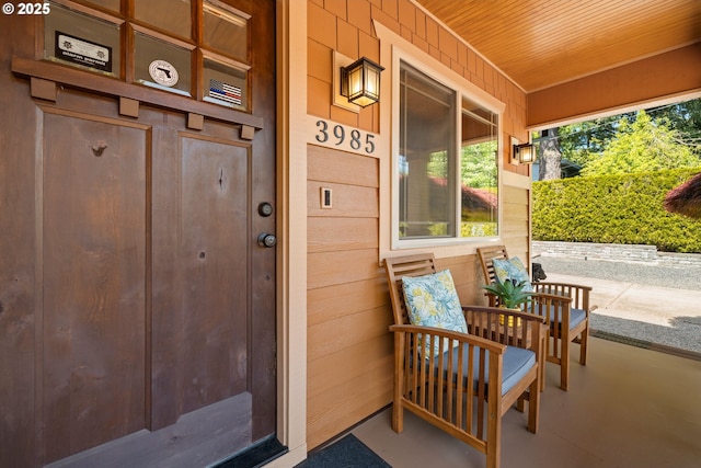 doorway to property with covered porch