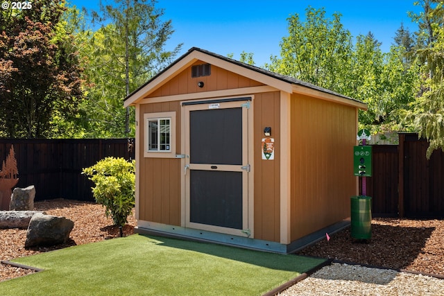 view of shed featuring a fenced backyard