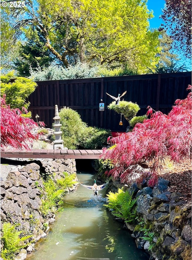 view of yard featuring fence