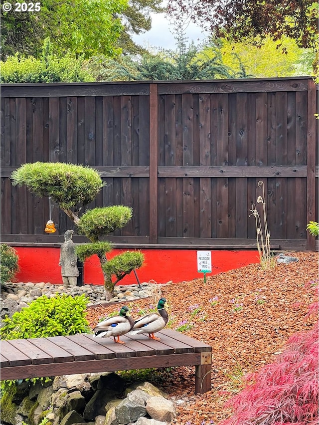view of yard featuring fence