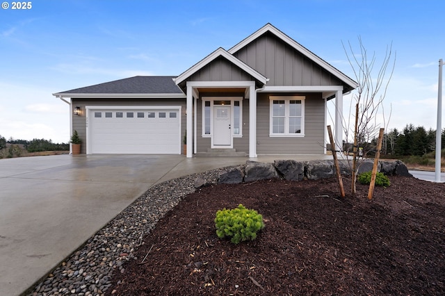 view of front of house with a shingled roof, a porch, board and batten siding, a garage, and driveway