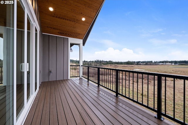 wooden terrace featuring a rural view