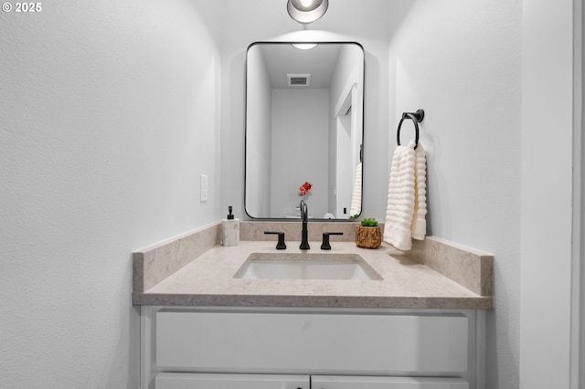 bathroom featuring visible vents and vanity