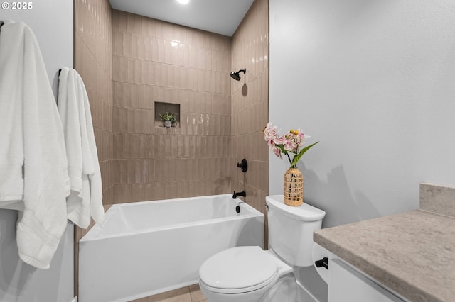 bathroom with toilet,  shower combination, and vanity