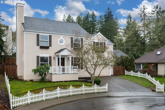 colonial-style house with a front lawn