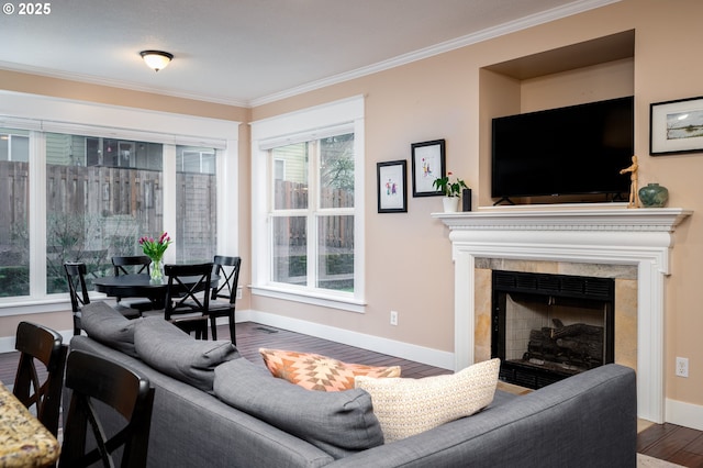 living room with ornamental molding and dark hardwood / wood-style floors