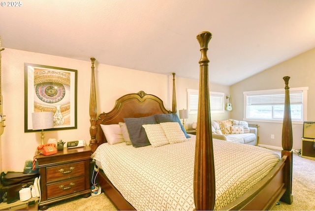 bedroom featuring light carpet and lofted ceiling