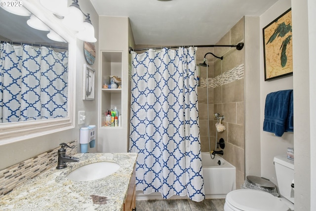 bathroom featuring shower / bath combination with curtain, toilet, vanity, and wood finished floors