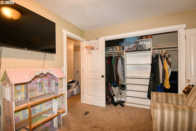 carpeted bedroom with a closet