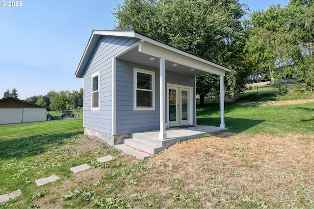 view of outbuilding with french doors