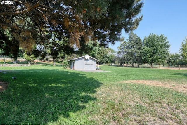 view of yard with an outbuilding and a detached garage