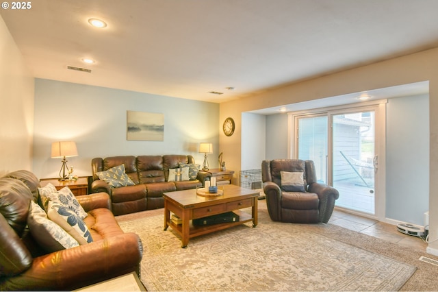 living room featuring tile patterned flooring, visible vents, recessed lighting, and baseboards